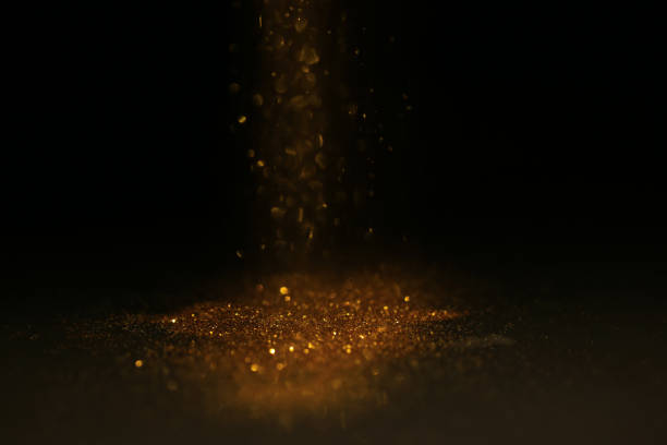 istock Abstract background of Sprinkle gold dust with glitter lights on black background 1160215799