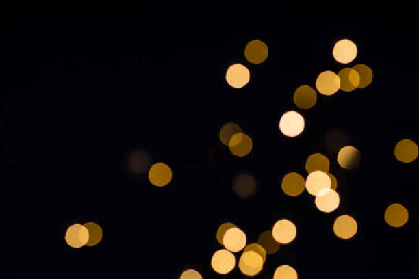 istock Gold bokeh lights shine. Black festive background 1160216526