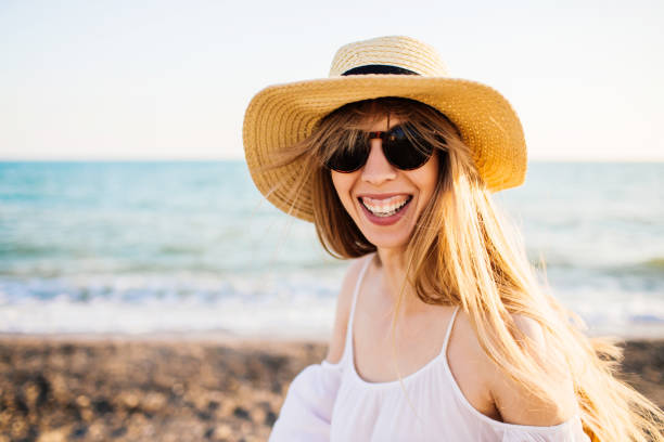 istock Young smiling girl relaxing at the beach. 1160218473