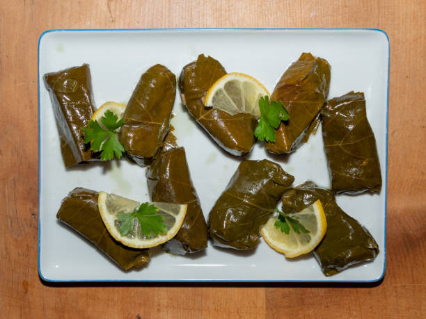 istock Sarma - Filled or Stuffed Vine Grape Leaves on Wood Table 1160219521