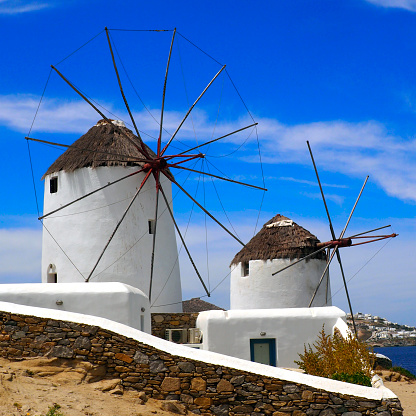 famous white windmills of Mykonos (Greece), Cyclades island in the heart of the Aegean Sea.