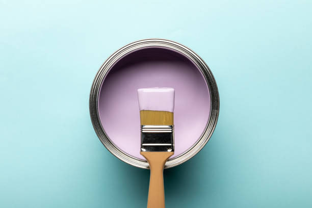 istock top view of tin with purple paint and brush on blue surface 1160221107