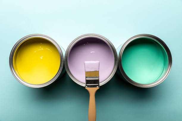 istock top view of three tins with paints and brush on blue surface 1160221108