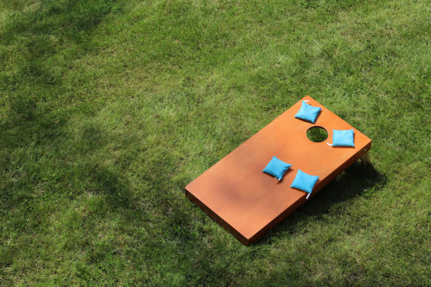 bird eye view of blue Bean Bag Toss Corn Hole Game top view of throwing Bags in a Hole cornhole bean bag toss lawn game bean bag stock pictures, royalty-free photos & images