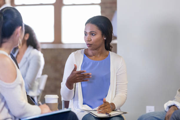 istock HOA president talks with neighbors during meeting 1160223356