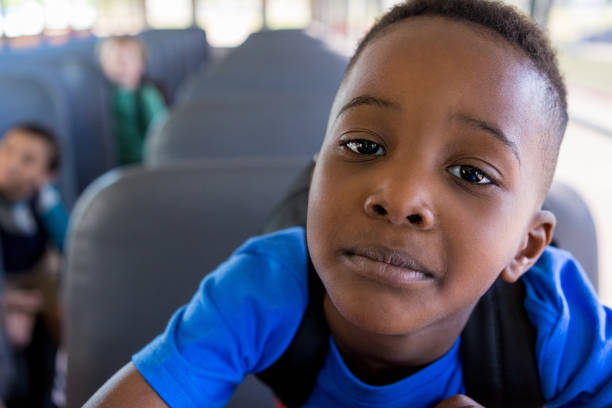 istock Young elementary boy on bus is worried about school 1160223411