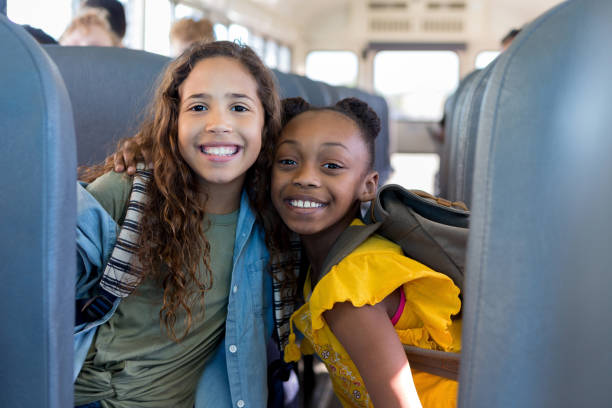 istock Good friends put arms around each other and smile 1160223686