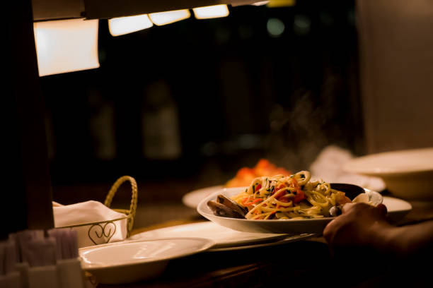 istock Chef holding plate with food at the restaurant 1160226288