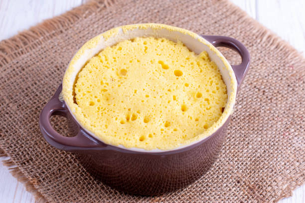 istock Dough in ceramic form. Cooking cupcake in the microwave 1160227065