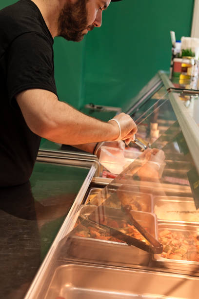 istock Owner working in zero waste oriented grocery and take out food store. 1160228665