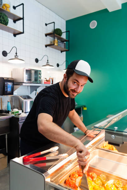 istock Owner working in zero waste oriented grocery and take out food store. 1160228724