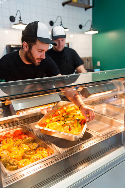 istock Employees working in zero waste oriented grocery and take out food store. 1160230157