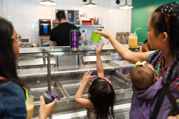Customers in zero waste oriented grocery and take out food store.