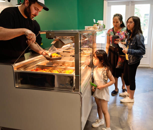 istock Customers in zero waste oriented grocery and take out food store. 1160231135