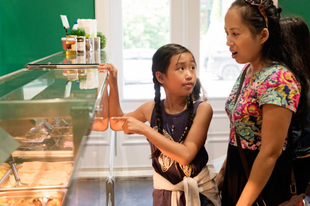Customers in zero waste oriented grocery and take out food store.