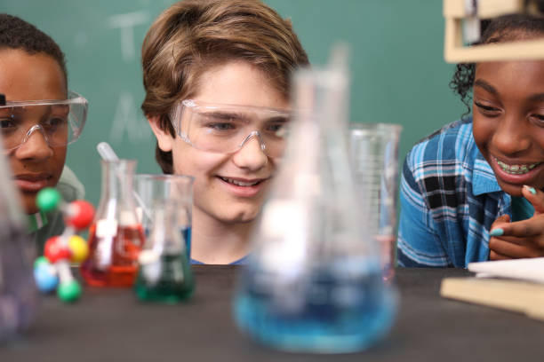 istock Junior high school age students conduct science experiments in classroom. 1160232358