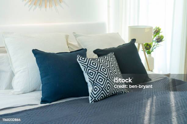 https://media.istockphoto.com/id/1160232864/photo/blue-and-white-bedroom-interior-with-potted-plant-in-front-of-a-large-bright-window.jpg?s=612x612&w=is&k=20&c=eI0_QppI2tnkGE9DhTIg2XaIeCp8IFb4P0KP_gW2hmI=