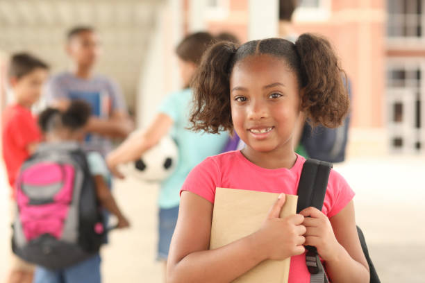 istock African descent, elementary age girl on school campus. 1160232876