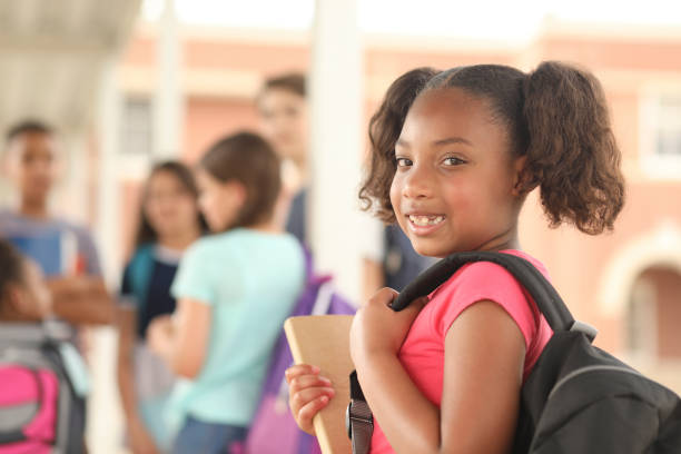 istock African descent, elementary age girl on school campus. 1160232883