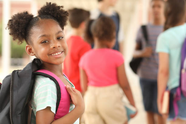 istock African descent, elementary age girl on school campus. 1160232900