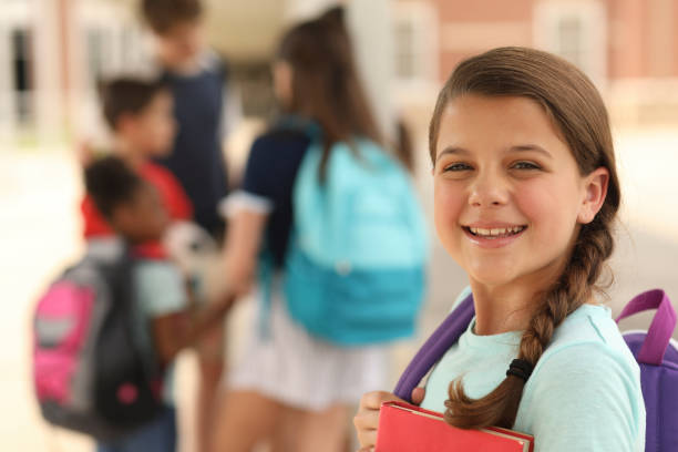 istock Latin descent, elementary age girl on school campus. 1160233468