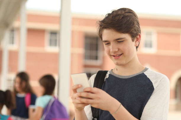 istock Latin descent, junior high age boy on school campus. 1160233512