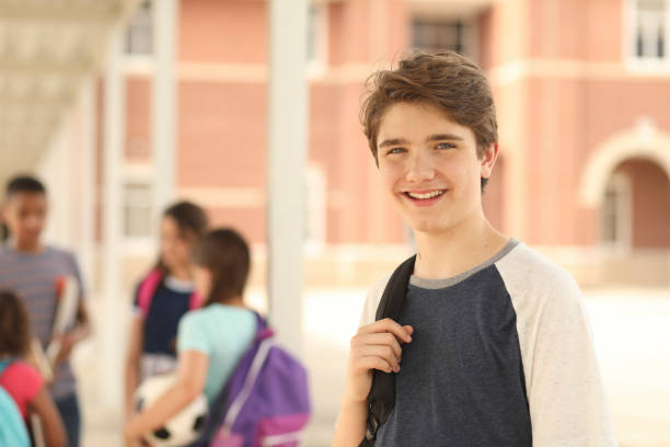 istock Latin descent, junior high age boy on school campus. 1160233527
