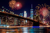 Brooklyn Bridge at dusk in New York City Colorful and vibrant fireworks