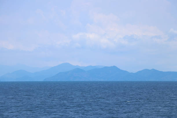 istock Blue sea with mountains and sky as background. 1160237377