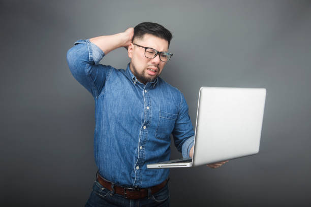 istock A man looked at the computer in surprise. 1160237747