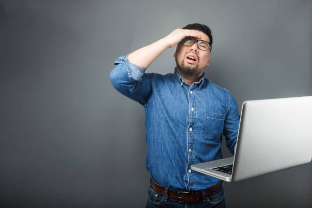 istock A man looked at the computer in surprise. 1160237785