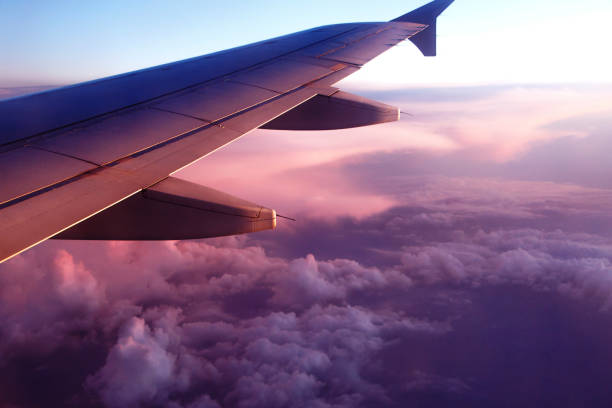 istock aircraft wing in the sky at sunset 1160238798
