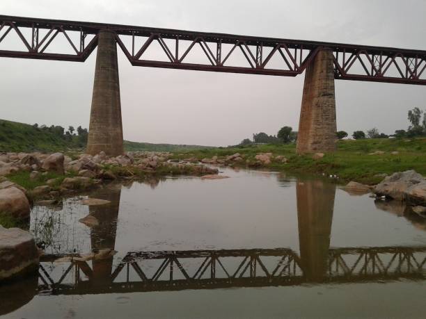 istock Old iron bridge over a river with a magnificent view 1160240119