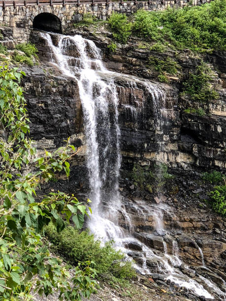 istock Mountain waterfall through pipe drain at national park 1160241096