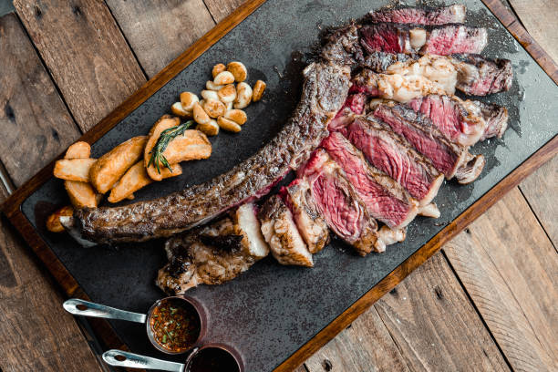 istock Grilled Australian Tomahawk Steak on Black Plate 1160241227