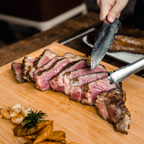 istock Grilled Australian Tomahawk Steak on Wood Plate 1160241252