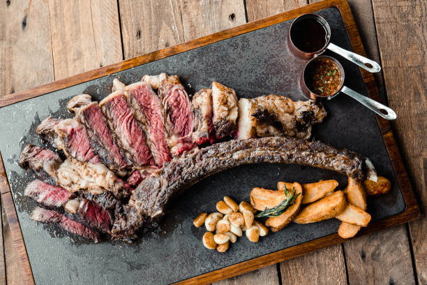 istock Grilled Australian Tomahawk Steak on Black Plate 1160241256