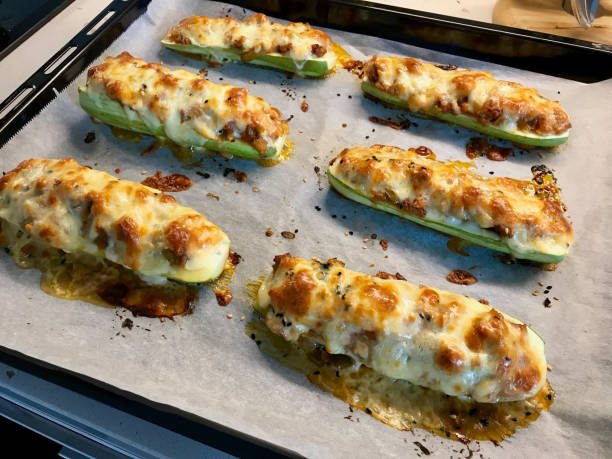 istock Baked Zucchini Courgettes Stuffed with Cheese and Dill. 1160243427