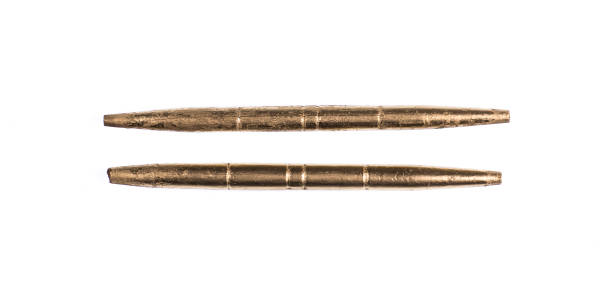 istock golden drum sticks on white background 1160243986