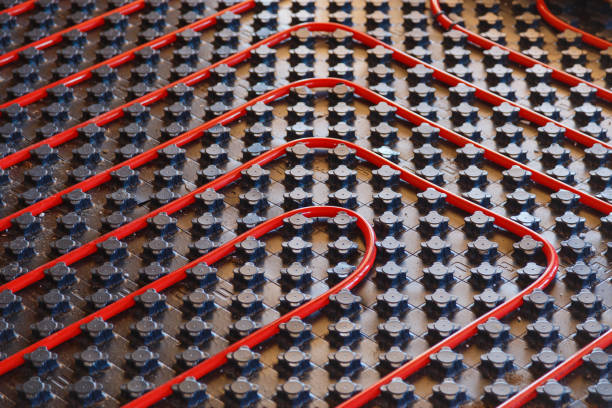 istock Floor heating pipe on black cover. Installation of engineering systems in a building. 1160244658