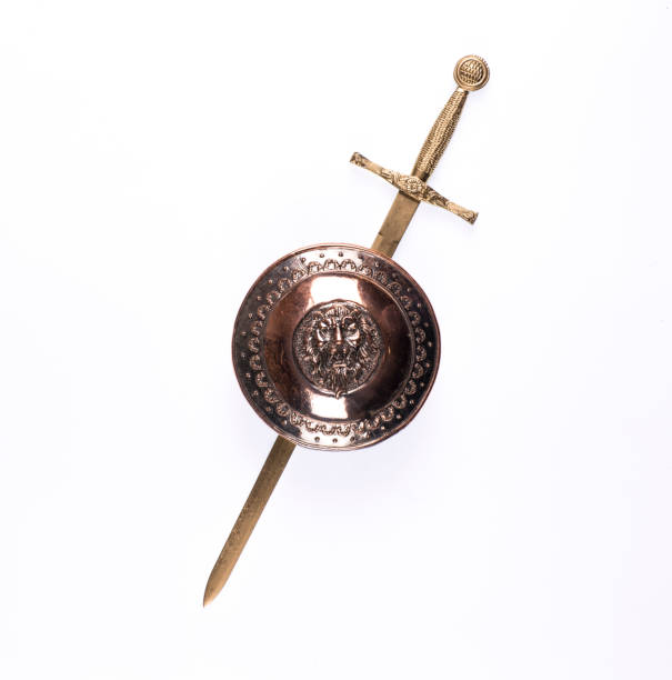 istock golden armor and sword on a white background 1160244816