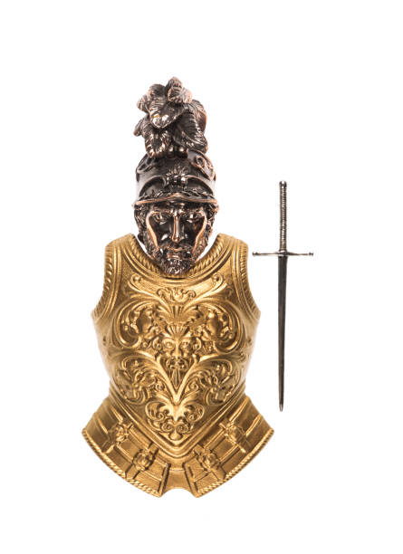 istock golden armor and sword on a white background 1160246098