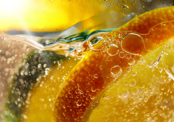 istock Carbonated drink or cocktail with lemon, abstract splashing. 1160248065