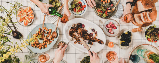 istock Flat-lay of people eating and drinking rose wine, wide composition 1160249571
