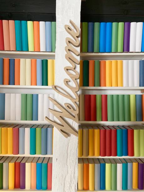 istock White books shelves: generic colorful books and welcome sign 1160249782
