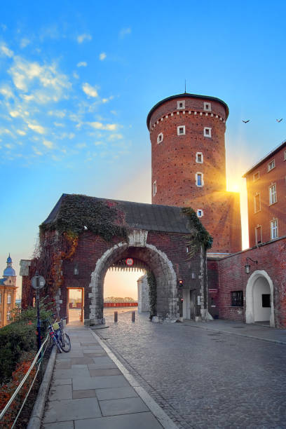 Ancient tower gates of Wawel Royal Castle in Krakow, Poland in beautiful sunset light Krakow, Poland - October 03, 2018: Ancient tower gates of Wawel Royal Castle in Krakow, Poland in beautiful sunset light. wawel cathedral photos stock pictures, royalty-free photos & images