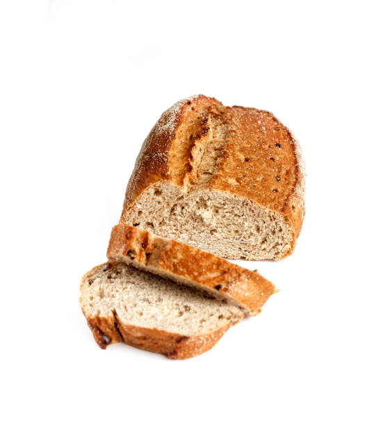 istock Loaf of whole wheat bread with slices isolated on white background 1160250729