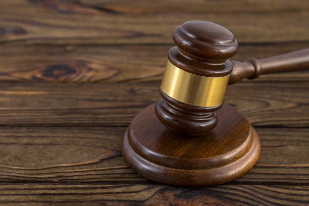 istock hammer of judge on a wooden table. 1160252721