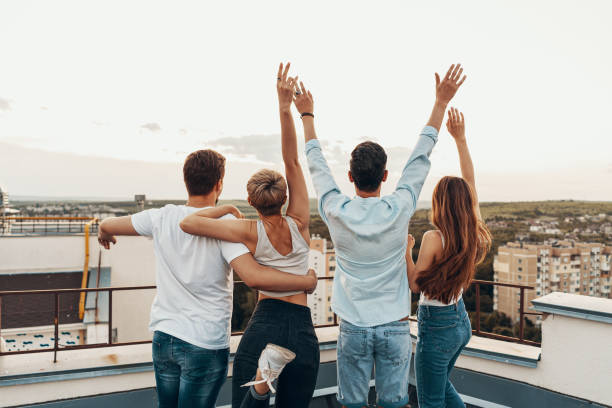 istock Group of friends enjoying outdoors at roof 1160252984