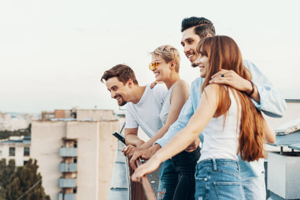 istock Group of friends enjoying outdoors at roof 1160252986
